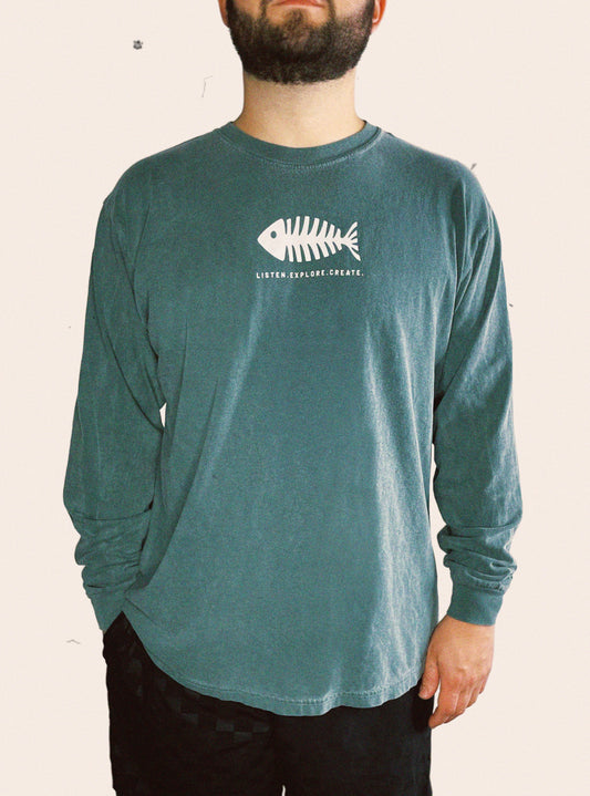 Blue spruce Comfort Colors long sleeve tee embellished with a fish skeleton and the words LISTEN. EXPLORE. CREATE.